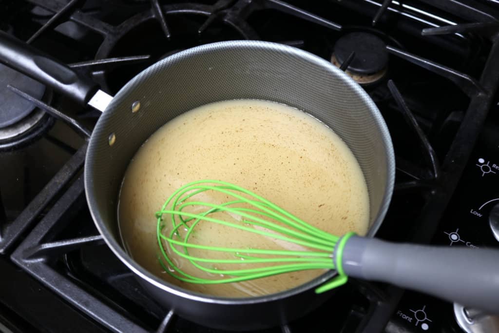 The best homemade apple syrup! This takes less than 5 minutes to make and uses ingredients you already have on hand. Paired with homemade whole wheat pancakes, and this makes a delicious meal. It's a great way to use up leftover apple juice! This would also make great neighbor Christmas gifts or gifts year round.