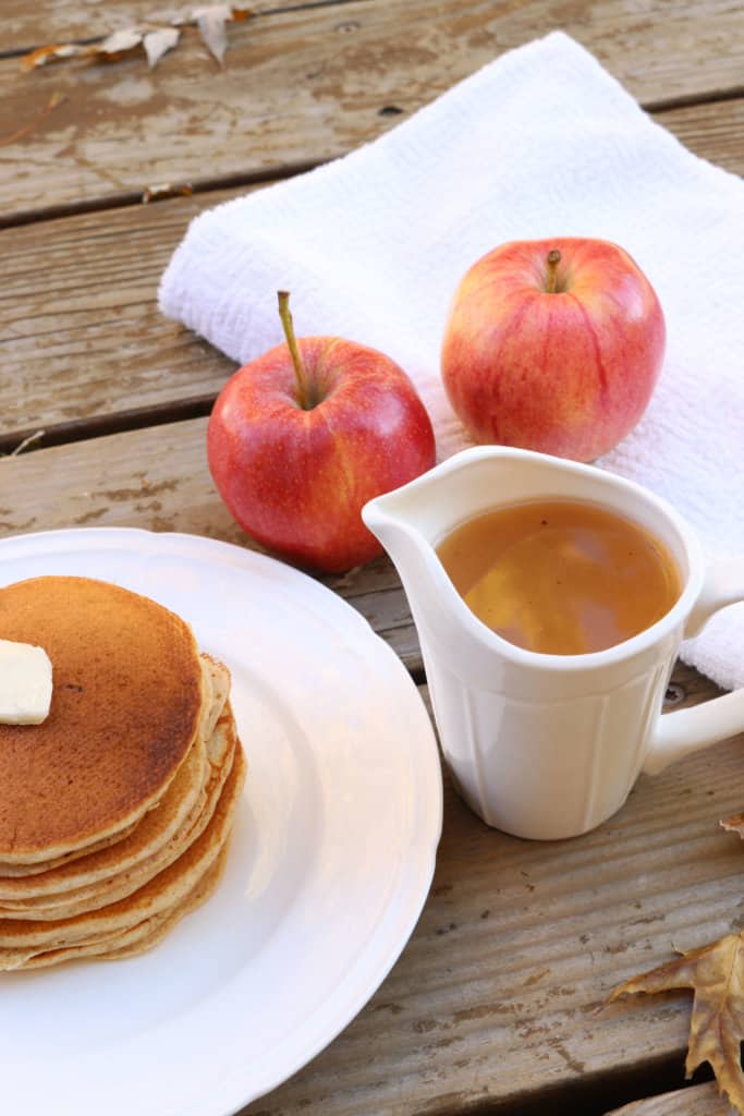 The best homemade apple syrup! This takes less than 5 minutes to make and uses ingredients you already have on hand. Paired with homemade whole wheat pancakes, and this makes a delicious meal. It's a great way to use up leftover apple juice! This would also make great neighbor Christmas gifts or gifts year round.