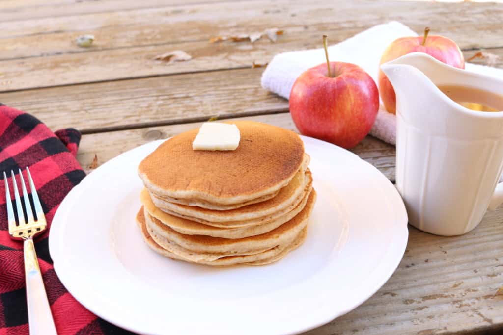 The best homemade apple syrup! This takes less than 5 minutes to make and uses ingredients you already have on hand. Paired with homemade whole wheat pancakes, and this makes a delicious meal. It's a great way to use up leftover apple juice! This would also make great neighbor Christmas gifts or gifts year round.
