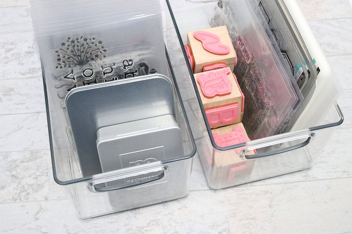 stamping craft supplies in clear bins