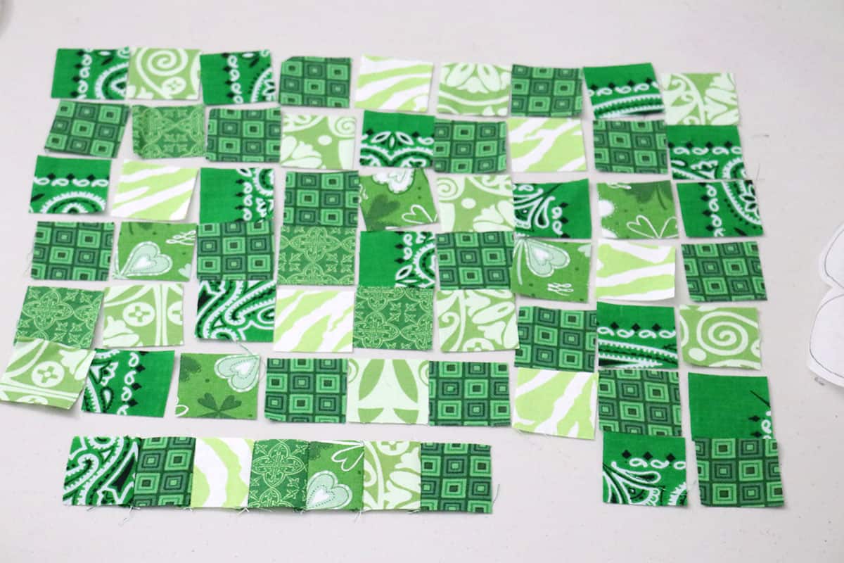 small green fabric squares on table