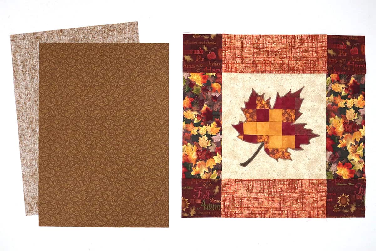 fall leaf and brown fabric cut to make envelope pillow cover
