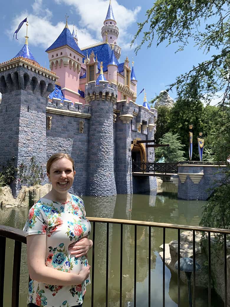 maternity photo shoot at Disneyland in front of the castle