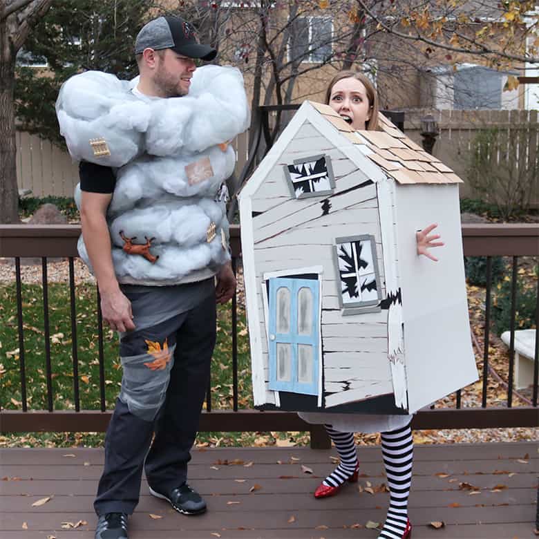 These Wizard of Oz Halloween costumes aren't the typical ones you see over and over! Learn how to make this Wicked Witch of the East and tornado couples costumes--from a box and a laundry hamper! A fun Halloween DIY.