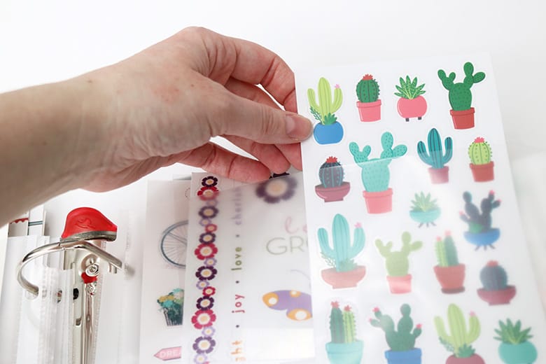 This is the best way to organize stickers! DIY sticker storage binders keep scrapbook and planner stickers organized by categories. Cheap, easy, and compact craft room storage!