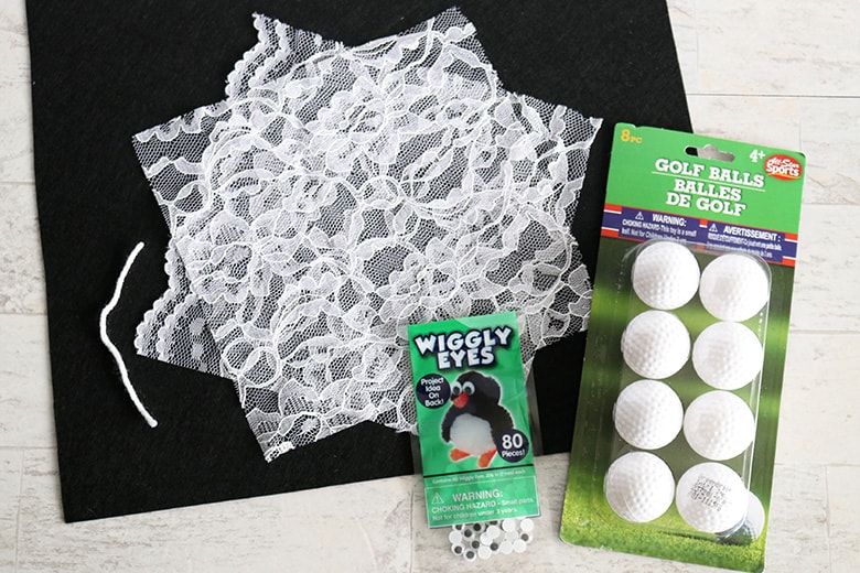 supplies to make a DIY lace ghost garland for Halloween