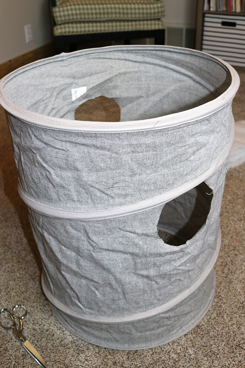 These Wizard of Oz Halloween costumes aren't the typical ones you see over and over! Learn how to make this Wicked Witch of the East and tornado couples costumes--from a box and a laundry hamper! A fun Halloween DIY.