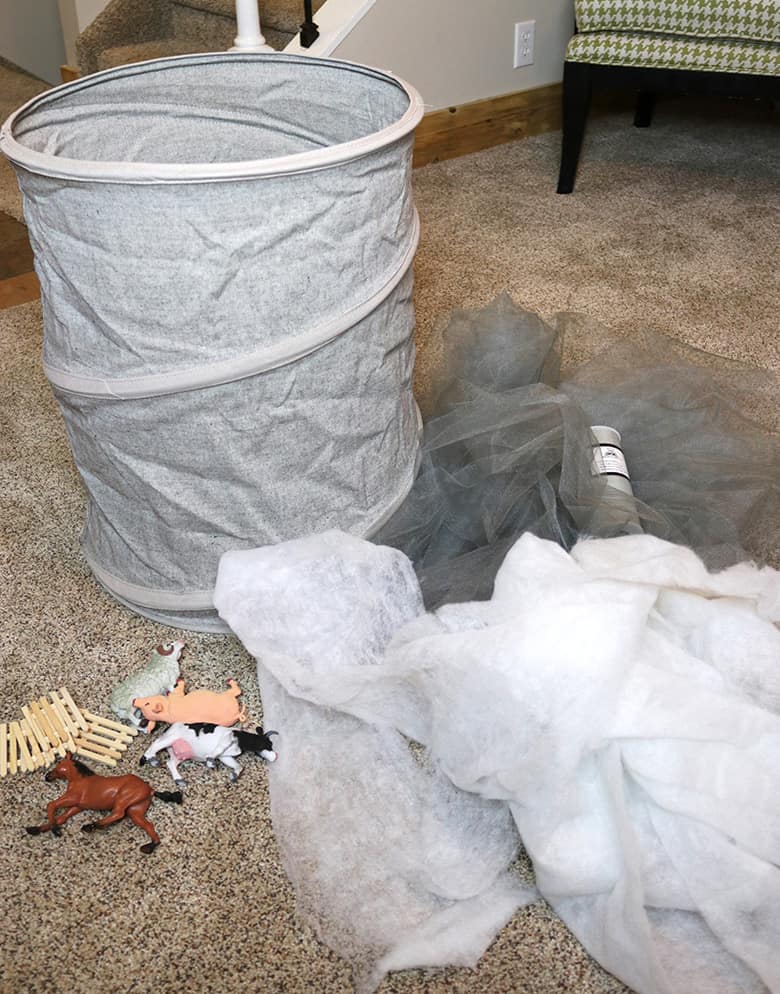 These Wizard of Oz Halloween costumes aren't the typical ones you see over and over! Learn how to make this Wicked Witch of the East and tornado couples costumes--from a box and a laundry hamper! A fun Halloween DIY.