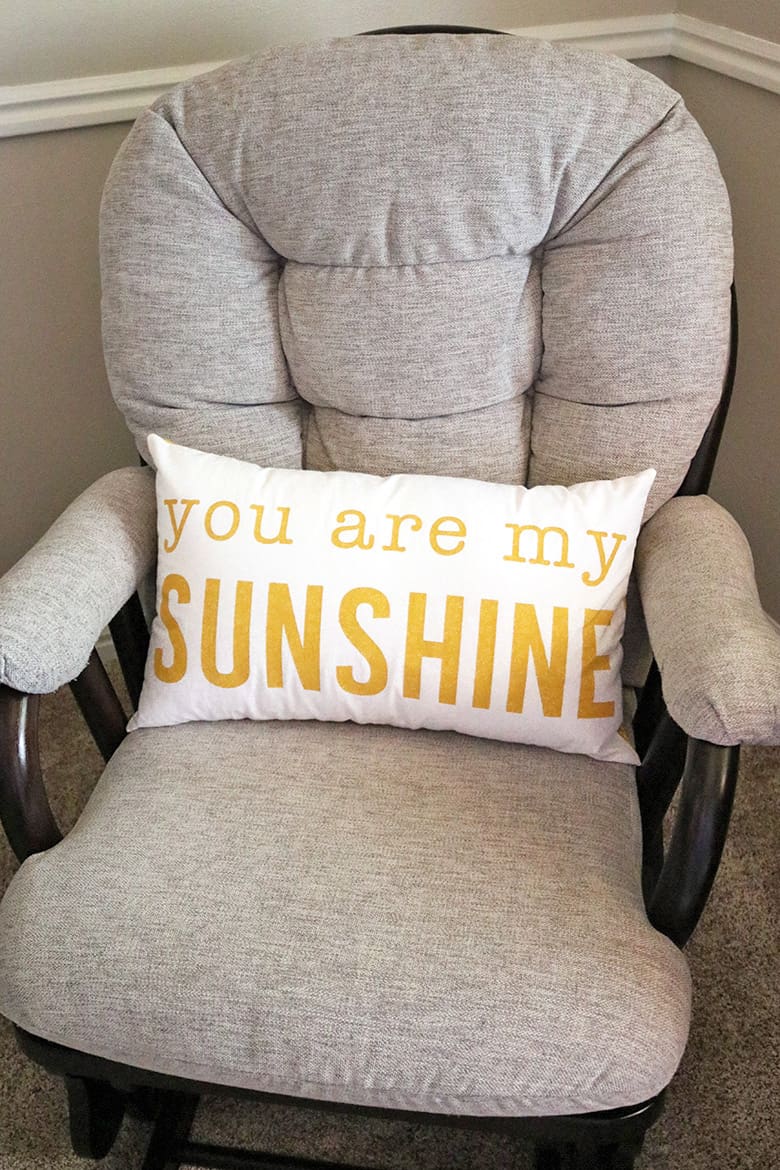 Learn how to make a You Are My Sunshine pillow for your nursery with Cricut freezer paper stencils.