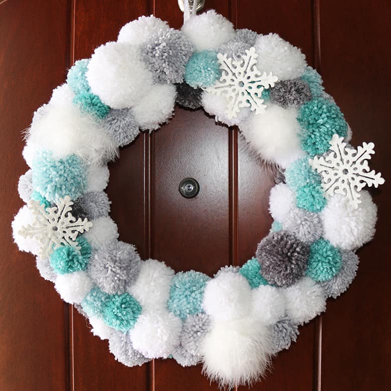 DIY winter pom pom wreath white turquoise snowflake craft