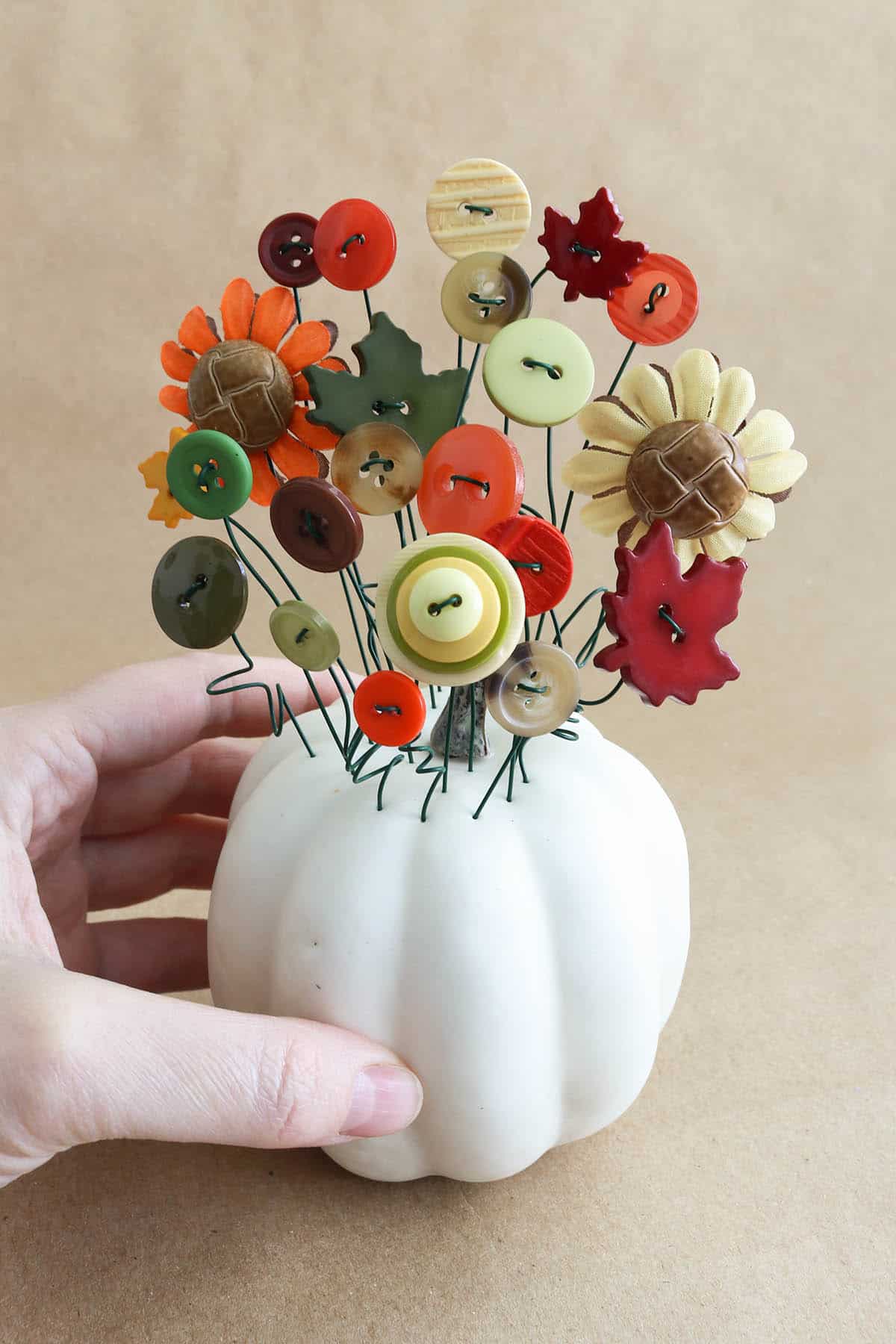 DIY fall button bouquet tutorial in a pumpkin