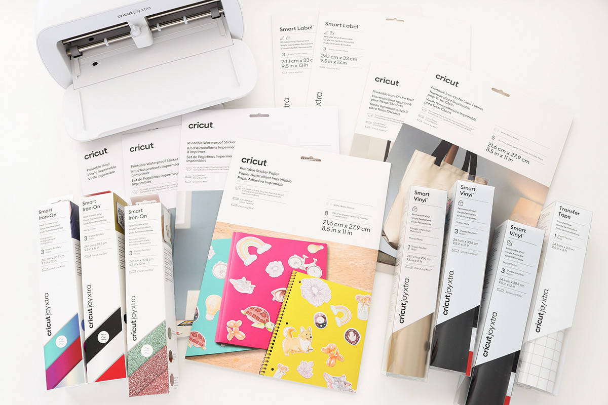 new Cricut Joy Xtra materials laid out in front of machine