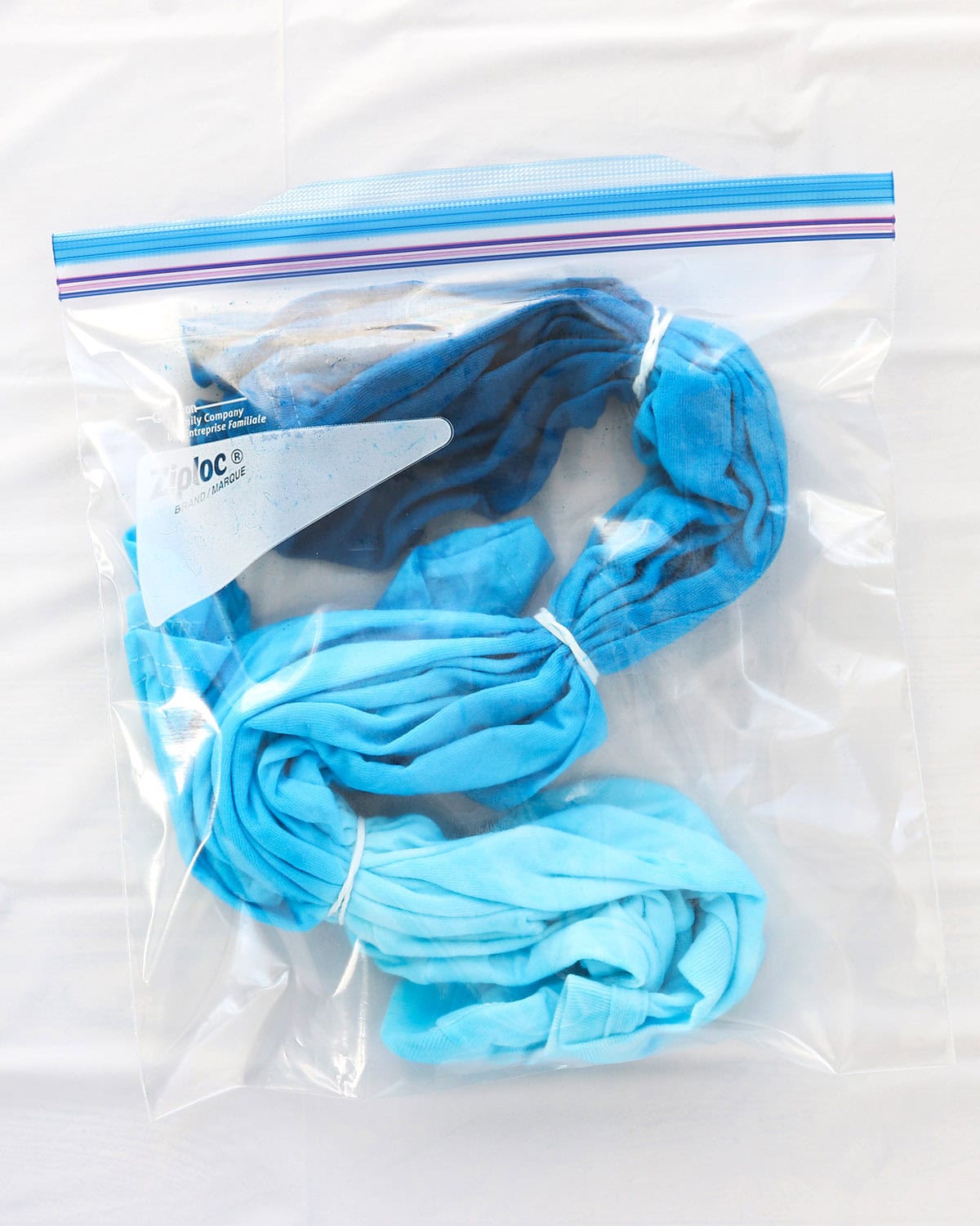 how long to let tie dye sit before rinsing