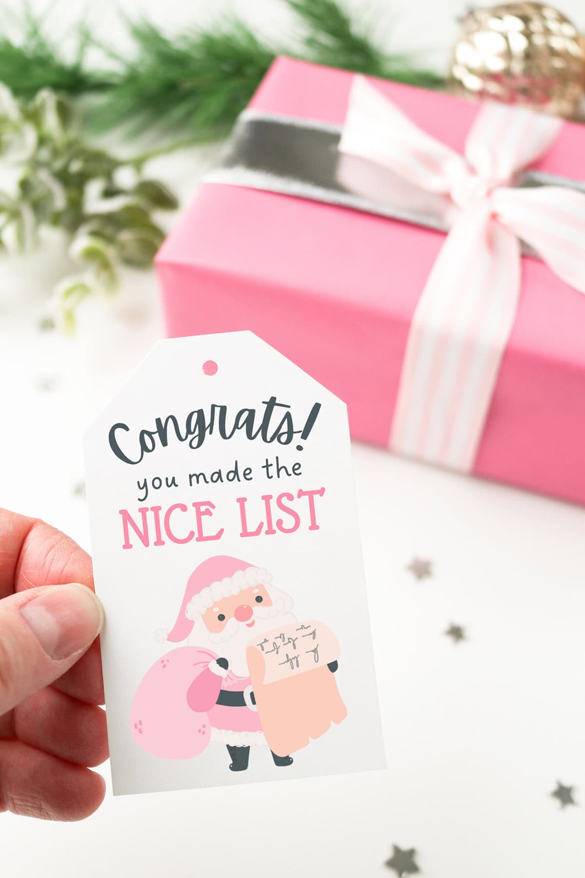 free printable pink Santa gift tags for Christmas pink present with tag mockup