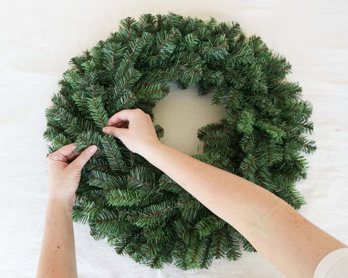 diy Christmas wreath with ornaments using evergreen wreath form